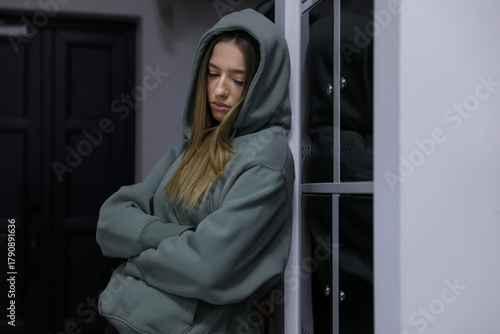 Free Download Depressed teenage girl near modern lockers indoors - GFXLoad