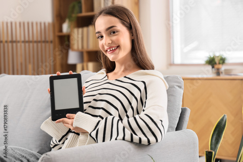 Young girl with e-reader at...