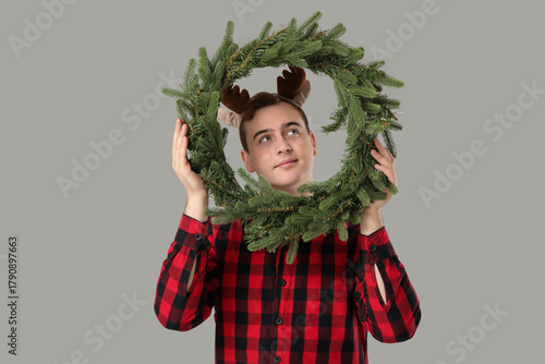 Young man in pajamas with C...