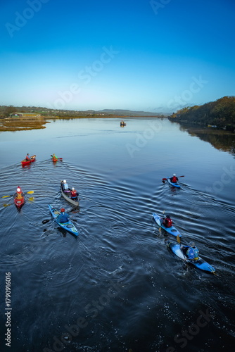 Kayakers on the river Axe near town of Seaton in Eat Devon, England