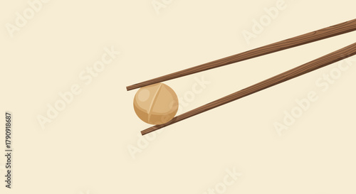 Wooden Chopsticks Pinching a Small, Round Food Item Against a Pale Yellowish Background