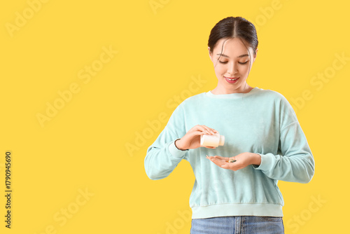 Young Asian woman taking vi...