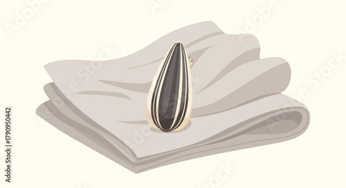 Sunflower Seed Resting Peacefully on a Stack of Textured Linen or Paper