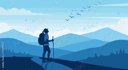 Silhouette Of Hiker Observing Birds Over Mountain Range In Azure Blue Landscape