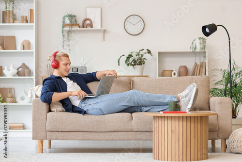 Young man in headphones wor...