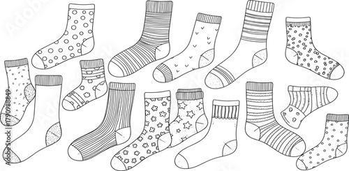 A hand-drawn collection of assorted socks with various patterns. Black and white outline doodle illustration set for a coloring page