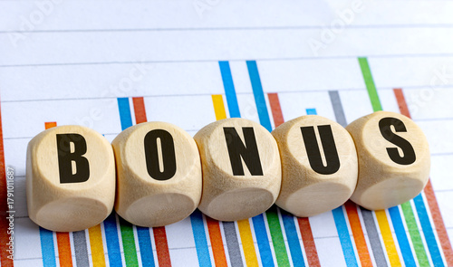  Wooden round blocks with word bonus on colorful business chart background