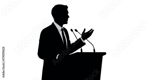 A silhouetted male figure in a business suit delivers a speech at a podium with microphones, gesturing with one hand.