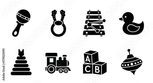 Black silhouette icons of baby toys including maracas, rattle, xylophone, rubber duck, stacking rings, toy train, alphabet blocks, and spinning top.