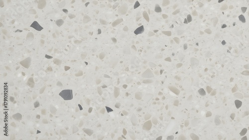 Light gray terrazzo stone texture with natural speckled mineral fragments, modern interior surface background

