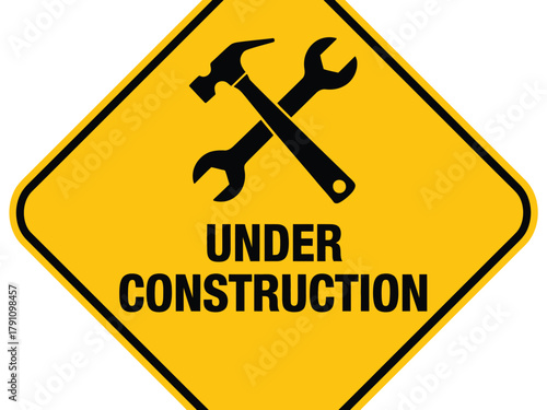 A yellow diamond-shaped sign displays a hammer and wrench crossed, indicating 'Under Construction'.