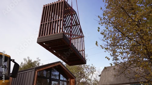 The process of moving and installing a terrace for a modular home.