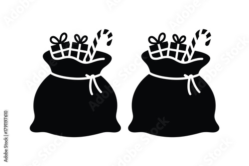 Two black silhouette bags overflowing with gifts and candy canes on a white background.