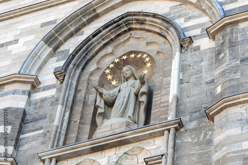 Montreal, Canada - August 11, 2025: Statue of the Virgin Mary on the facade of the Notre-Dame Basilica in Old Montreal