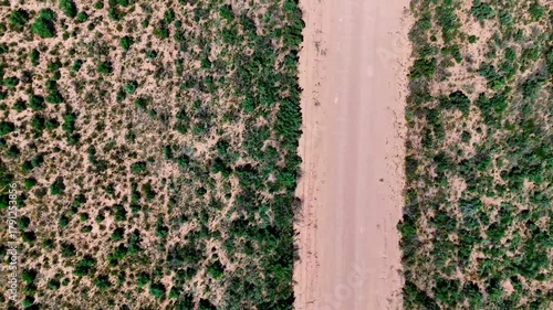 Aerial top down of rural desert road in summer historic US route 66 San Jon New Mexico NM
