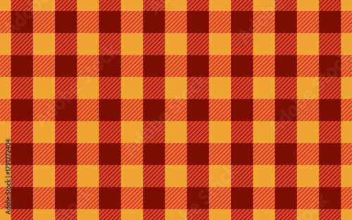 Orange and brown plaid seamless pattern for christmas decoration. Festive lumberjack fabric background with classic buffalo check design.