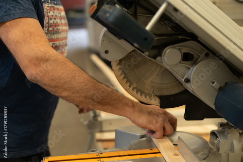 Young man renovating a caravan to convert it into a camper van