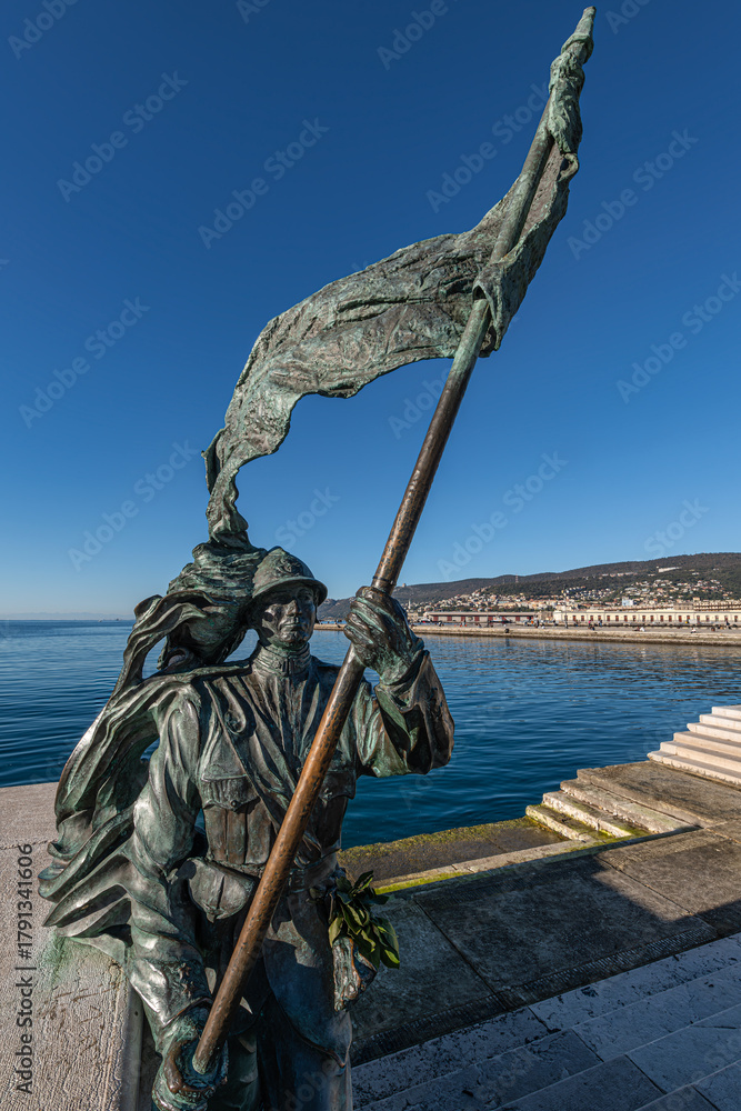 Fototapeta premium Monumento per la Liberazione, The statue of the Bersagliere in Piazza Unita d`Italia in Trieste, Friuli Venezia Giulia, Italy