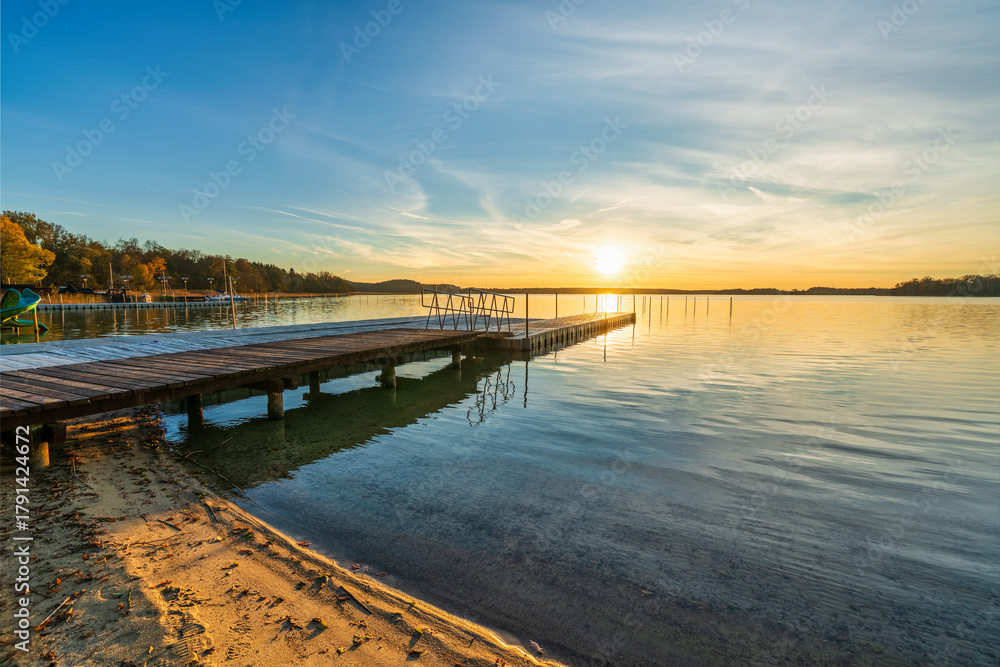Obraz premium Pier at Lubikowo lake at sunset. Poalnd