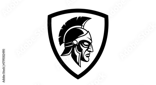 A black and white illustration of a Spartan warrior's helmet and profile within a shield.