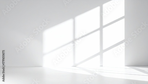 Sunlight streams into a minimalist white room