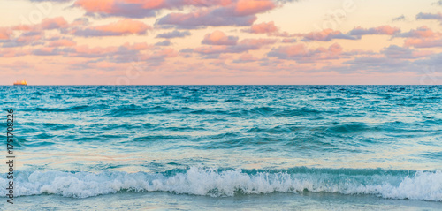 Fototapeta Naklejka Na Ścianę i Meble -  Dramatic sunrise horizon at sea. Romantic summer vacation on sunset seascape. Sea sunset on ocean. Sunset seascape at summer vacation. Sunrise with sea beach. Sea waves