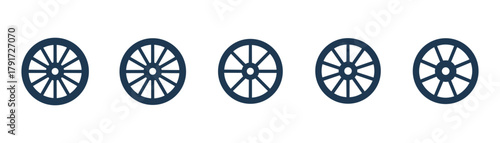 Set of old classic wooden wagon wheels. Farm cart wheel collection