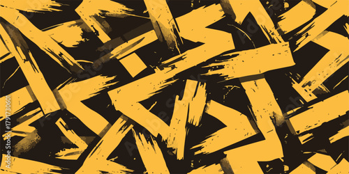 Abstrakcyjny wzór pociągnięć pędzlem w kolorze żółtym i czarnym, dynamiczny i nowoczesny.