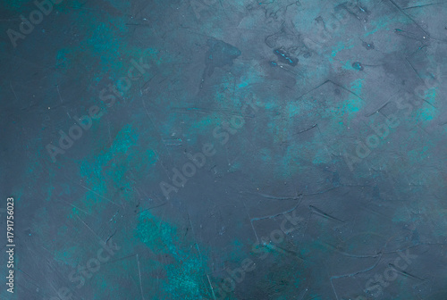 Abstract textured background with a cool color palette featuring subtle hints of teal and green against a dominant slate gray