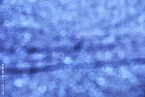 光をぼかした青の背景素材