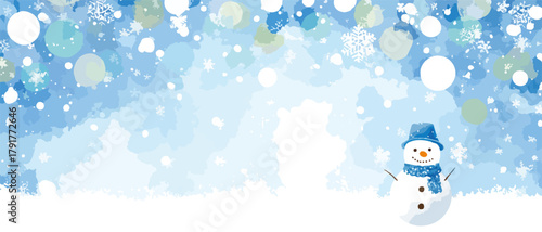 Śnieżny bałwanek z szalikiem i czapką na tle niebieskiego, zimowego krajobrazu z płatkami śniegu.