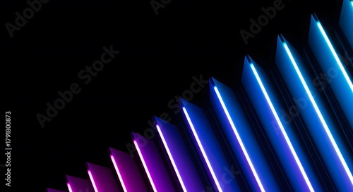 Abstract neon light streaks glowing blue and purple lines on a black background modern design