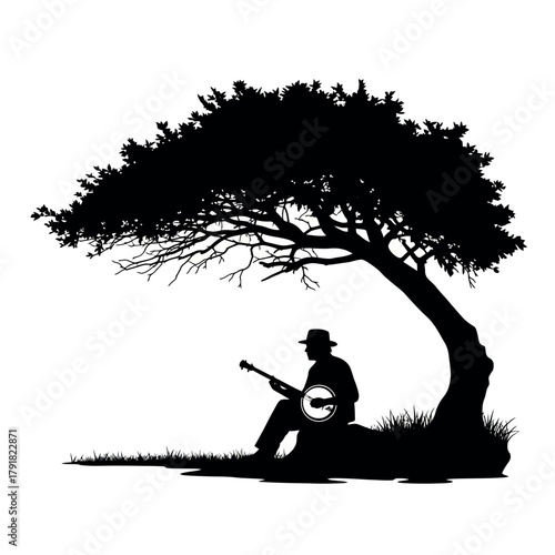 Silhouette of a man playing a banjo under a large tree.