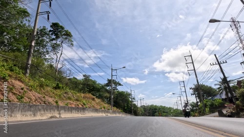 Sunny Drive Along Urban Road in Phuket, Thailand