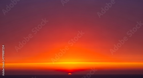 Breathtaking Sunset Over Sea Glowing Horizon Intense Colors Twilight Natural Scenery Vibrant Sky Fiery Atmosphere Landscape