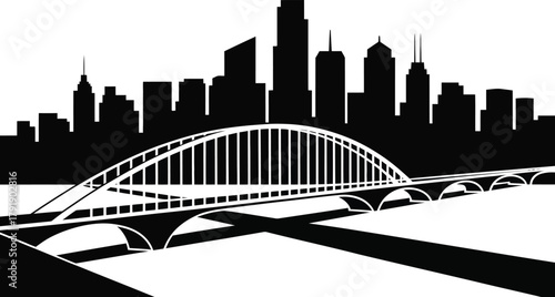 A silhouetted cityscape with a prominent bridge in the foreground.