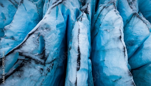 Close up Abstract Texture of Vibrant Blue Glacier Ice Crevasses and Seracs Extreme Cold Climate Background