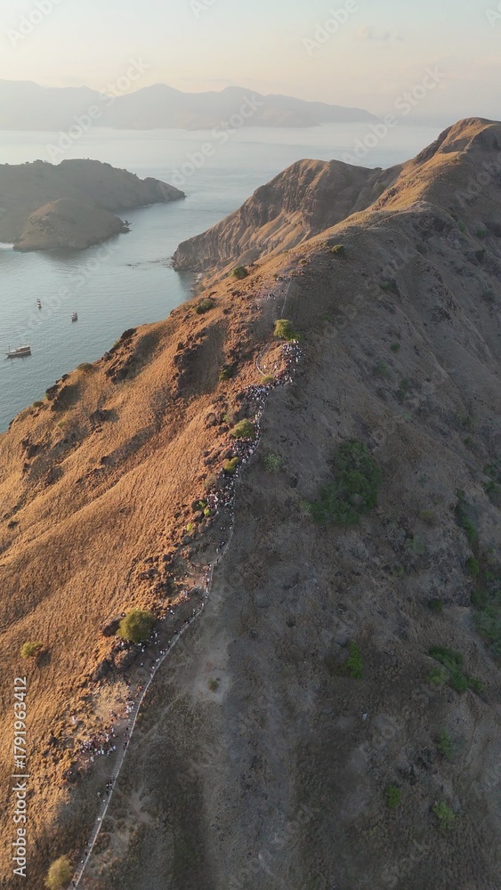 Fototapeta premium Scenic aerial panorama of Komodo National Park with islands surrounded by blue ocean
