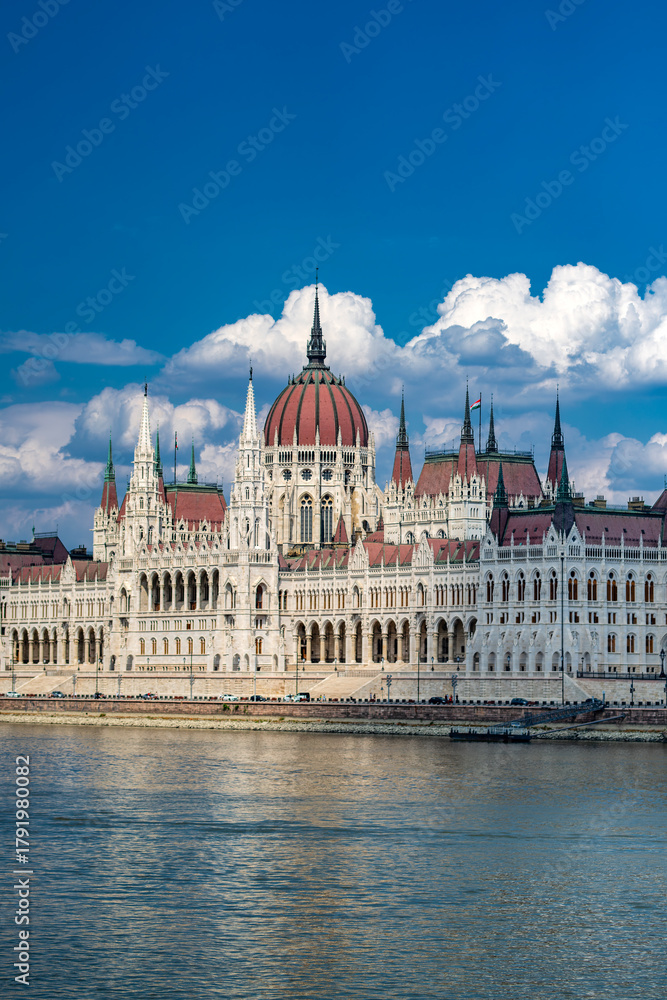 Fototapeta premium Hungarian Parliament Building on Danube River in Budapest. Beautiful view of Budapest Parliament with reflection in water. Iconic Hungarian landmark. Budapest cityscape with Parliament.