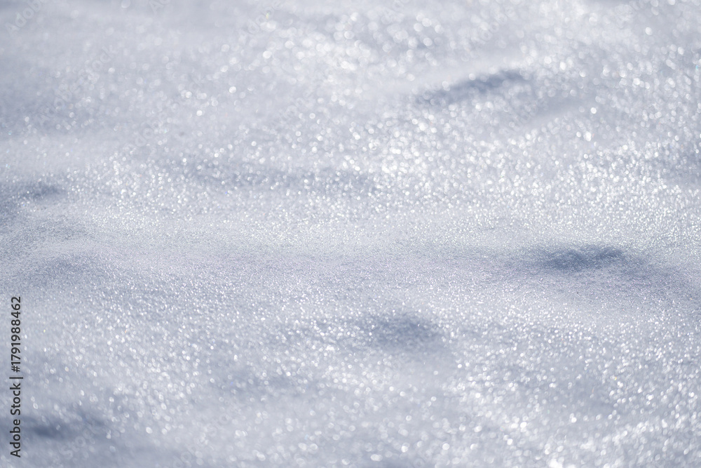 Obraz premium White snow background with texture detail. Frozen snowy texture with snow sparkles. Snowflakes on white snowy background. Winter backdrop with snow.