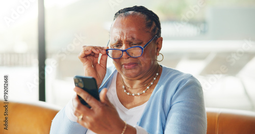 Fotografie Old woman, glasses or struggle with phone reading, vision problem or small font size for difficulty