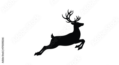 Black silhouette of a majestic stag with large antlers leaping through the air