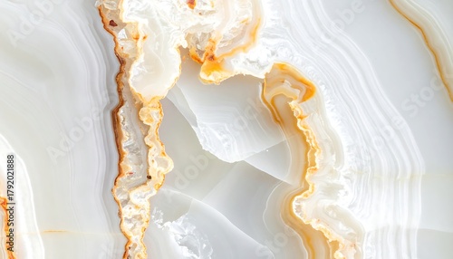 Close-up of polished, veined, translucent stone with orange and white tones