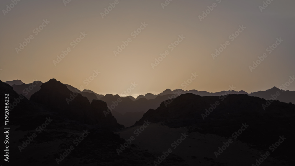 Obraz premium rocky mountains and desert landscape and sunset sky in Egypt