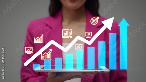 Video illustration of businesswoman in a pink blazer holding a tablet displaying a rising bar graph and arrow, symbolizing financial growth and success
