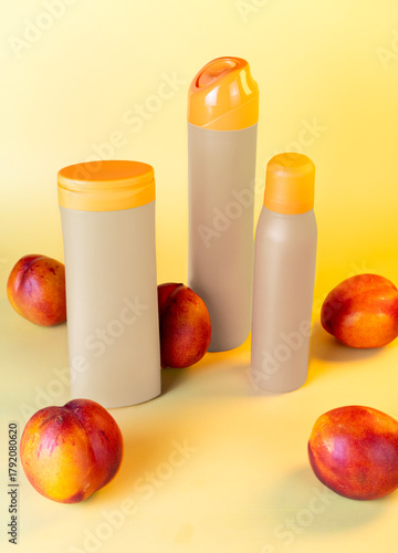 Package for shampoo, spray, deodorant setup with peaches background, mockup