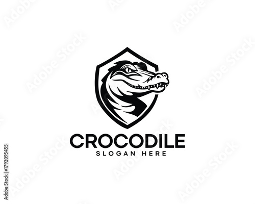 crocodile head silhouette inside shield logo design inspiration