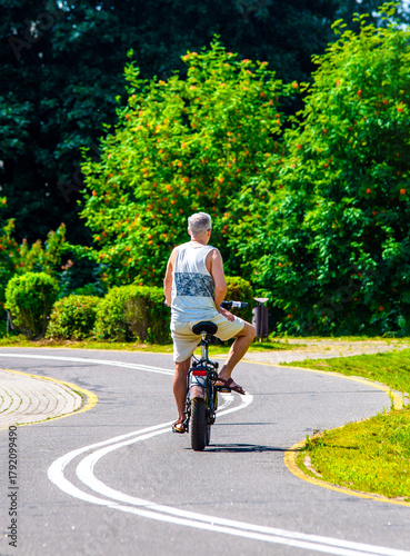 Cyclist ride on the bike path in the city Park
