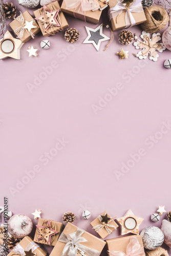 Festive Christmas background with different size gift boxes and Christmas decorations. Top view. Copy space for text.