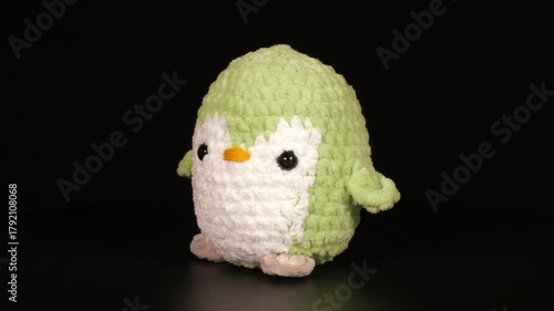 Close-up footage of animal figures knitted with threads.